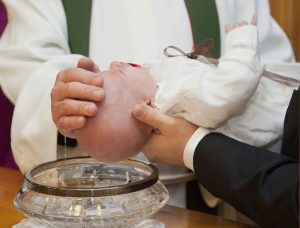 Baby being christened in the Roman Catholic faith