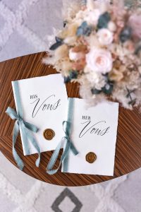 His and Her wedding vows on a table